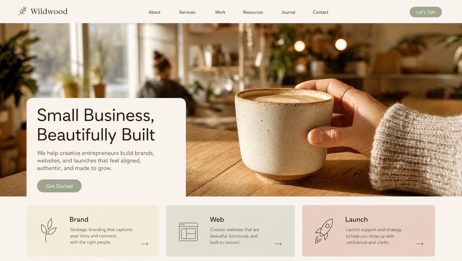 Website mockup — Boutique style — soft cream + sage + dusty rose, lifestyle photo of a hand holding a coffee cup.